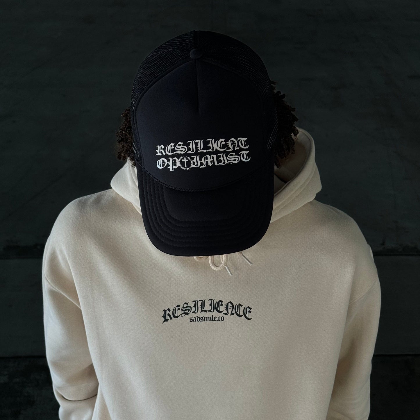 SADSMILE.CO Resilient Optimist Trucker (Black)