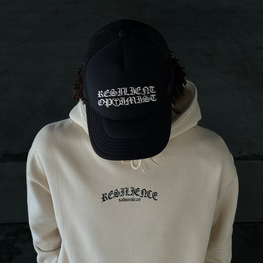 SADSMILE.CO Resilient Optimist Trucker (Black)